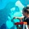 A young woman painting a mural in NOMa neighborhood